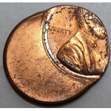 UNITED STATES OF AMERICA . UNDATED . ONE 1  CENT COIN . ERROR . MIS-STRIKE